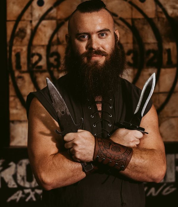 Silhouette of a man standing strong against a dark background.